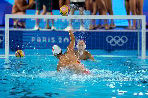 Chinese women's players warm up during a training